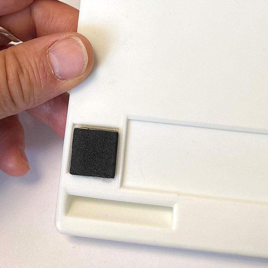 Magnetic pen holder for 4 pens, white plastic with 4 magnets on the back (also includes 4 adhesive pads)